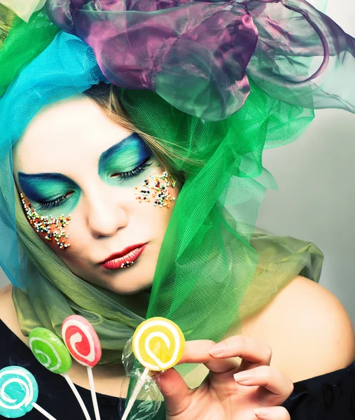 Young woman with sweets — Stock Photo, Image