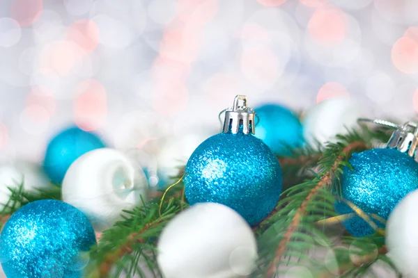 Christmas card with balls, spruce twig and bokeh — Stock Photo, Image