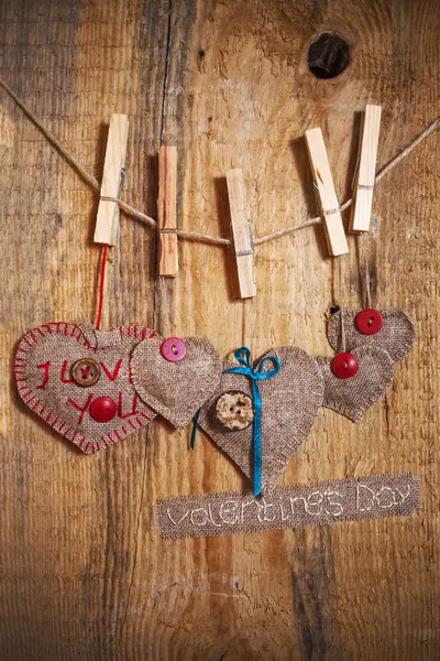 Decoration on Wooden background with fabric Hearts and words Val — Stock Photo, Image