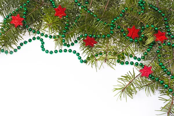 Vánoční ozdoby na pozadí hvězdné hvězdy zelené smrkové větvičky — Stock fotografie