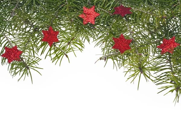 Christmas decorations background spruce twig green star stars — Stock Photo, Image