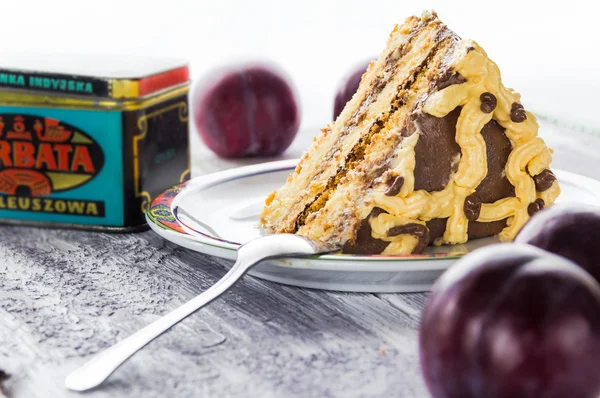 Slice sweat cake cream wooden table board white plum plums — Stock Photo, Image