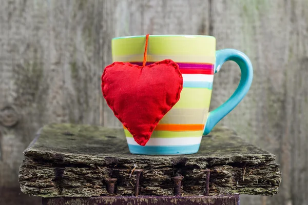 Heart hung colored cup — Stock Photo, Image