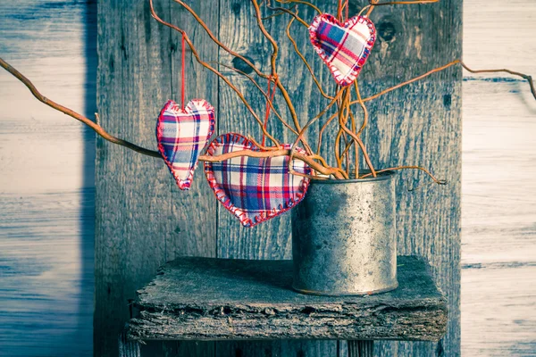 Three hearts hanging branches can — Stock Photo, Image