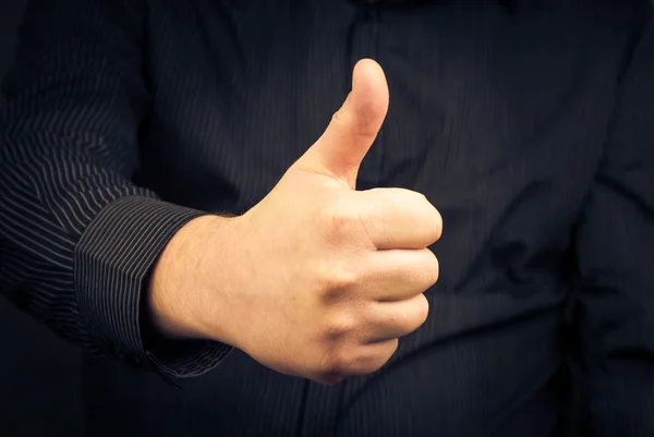 Closeup man hand showing thumb — Stock Photo, Image