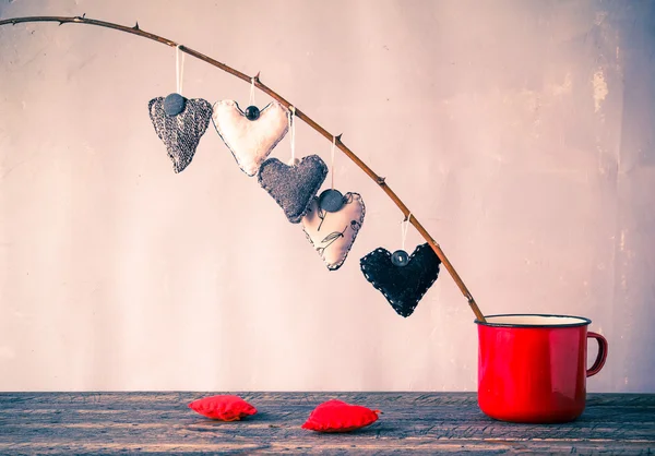 Heart hanging twig red cup — Stock Photo, Image