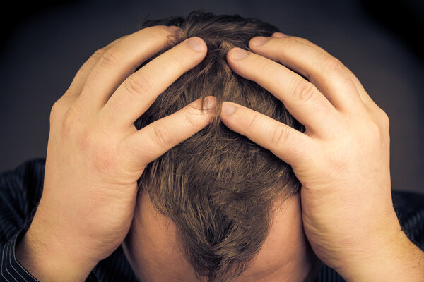 depressed man his hands face