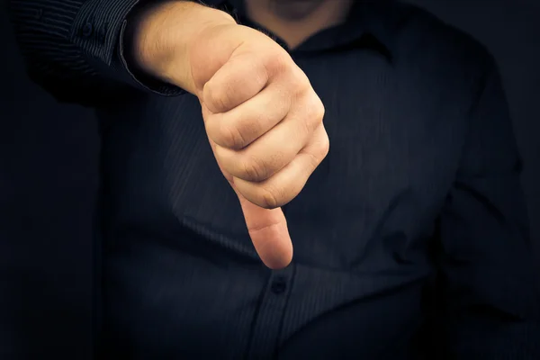 Closeup man hand showing thumbs down — Stock Photo, Image