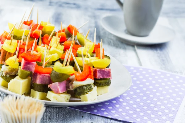 Finger foods toothpicks appetizer — Stock Photo © Yotka #39724055