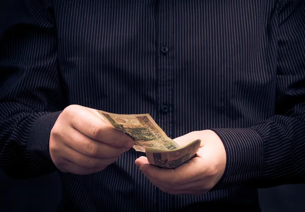 Closeup man calculating Polish money — Stock Photo, Image