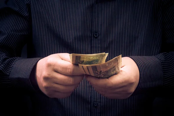 Closeup man calculating Polish money — Stock Photo, Image