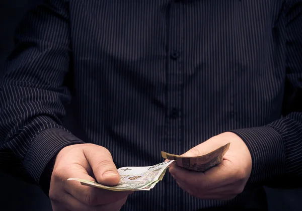 Closeup man calculating Polish money — Stock Photo, Image