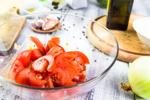 Freshly chopped tomatoes glass dish — Stock Photo, Image