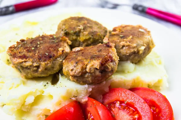 Fried pork chops boiled potatoes tomatoes — Stock Photo, Image