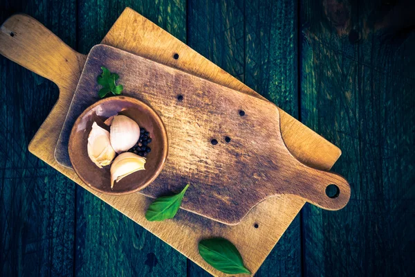 Cutting boards spices old wooden table — Stock Photo, Image