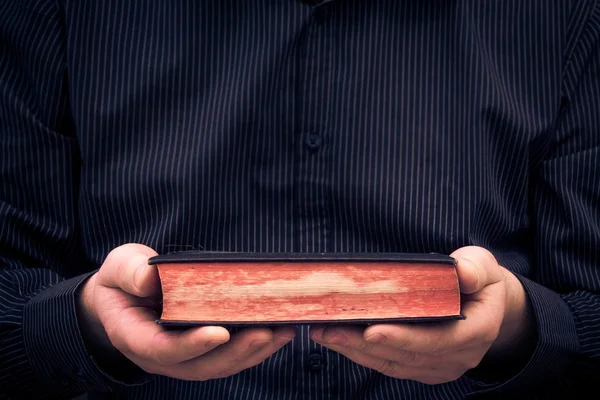 Man holds hands old book — Stock Photo, Image