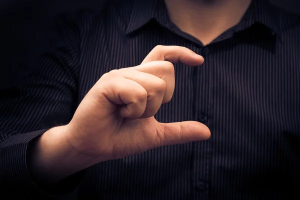 Man hand holding gadget showing size something — Stock Photo, Image