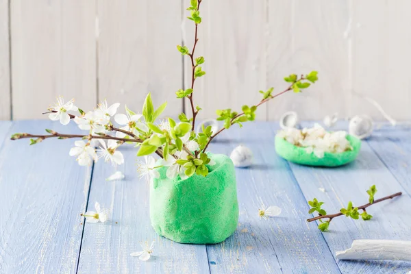 Spring blooming twigs wooden table — Stock Photo, Image