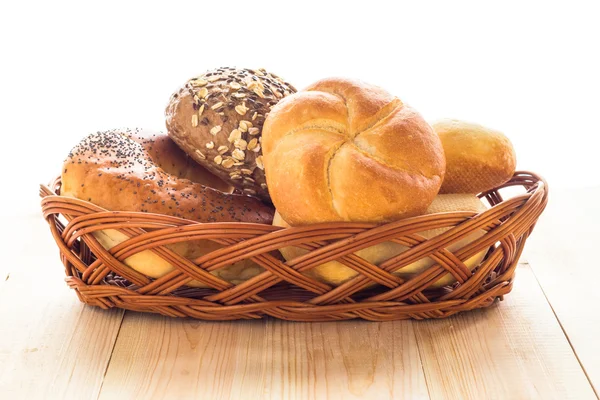 Wicker basket different types bread rolls — Stock Photo, Image