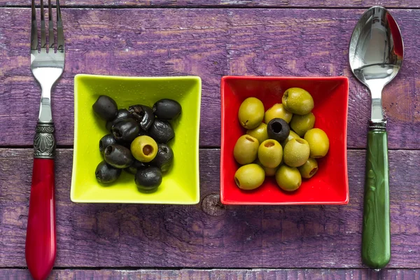 Colorful fruits olives bowls wooden table — Stock Photo, Image