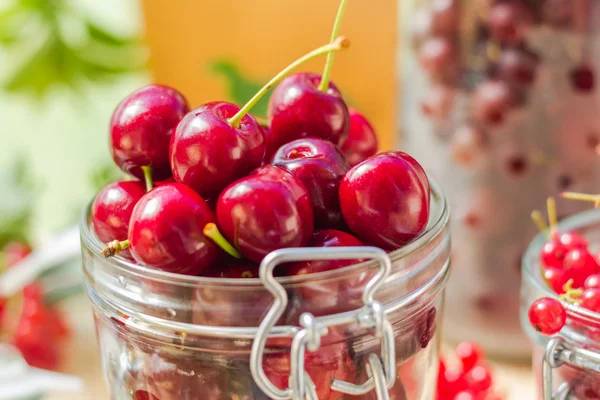 Summer fruits closeup cherries jar processed — Stock Photo, Image