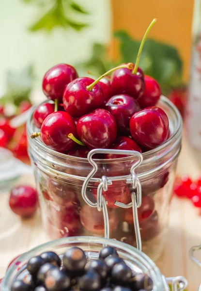 Summer fruits closeup cherries jar processed — Stock Photo, Image