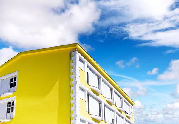 Sunny house on blue sky — Stock Photo, Image