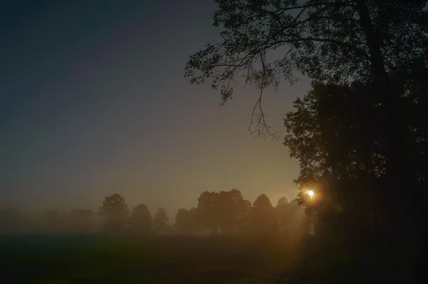 Zon achter de wolken — Stockfoto