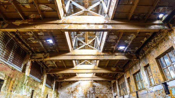 Wide angle view of an old wall abandoned factory building