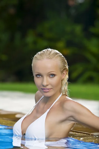 Portrait of young attractive woman having good time swimming pool Royalty Free Stock Images