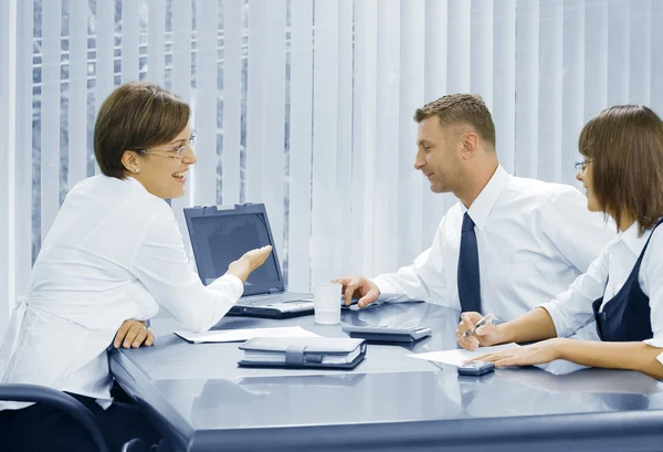 Portrait of young business discussing project in office environment — Stock Photo, Image