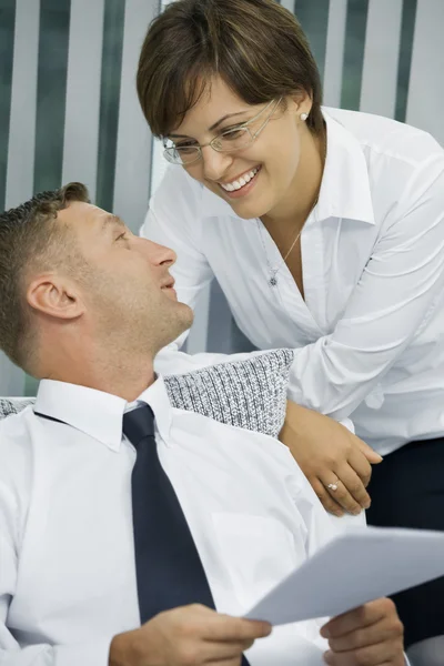 Portrait of young business discussing project in office environment — Stock Photo, Image