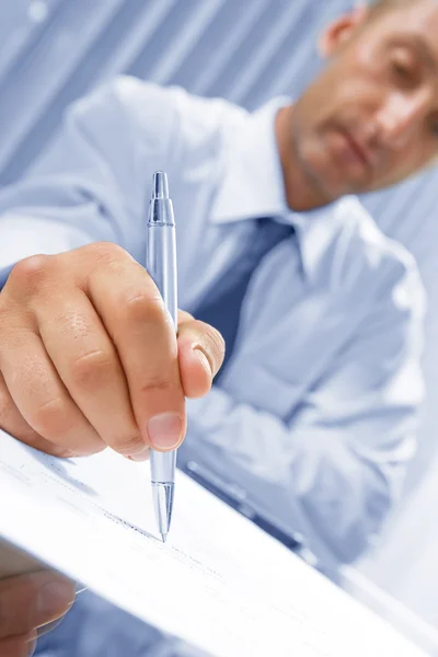 Portrait of young attractive businessman in office environment — Stock Photo, Image