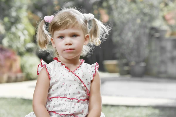 Portrait of little girl having good time in summer environment — Stock Photo, Image