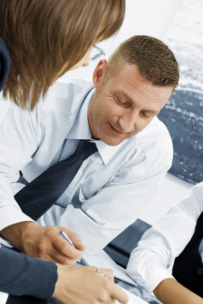 Portrait of young business discussing project in office environment — Stock Photo, Image