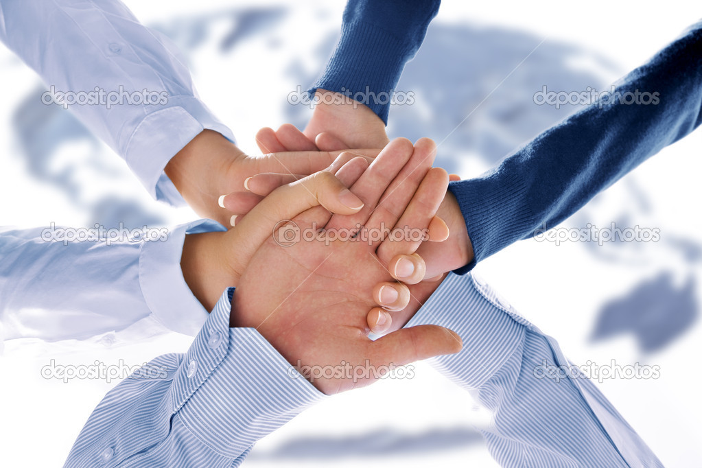 Close up view of hands getting together in office environment