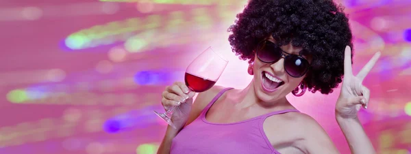 Close up portrait of young woman in afro wig on color back — Stock Photo, Image