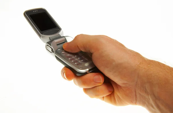 Teléfono móvil abierto en hoja blanca — Foto de Stock