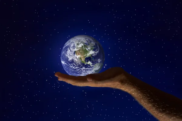 View of humans palm with planet earth on it — Stock Photo, Image