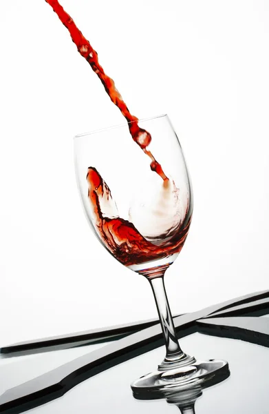 Close up view of wineglass getting filled with red wine — Stock Photo, Image