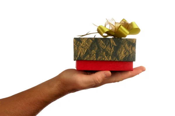 View of humans hand and nice colorful box with present on it — Stock Photo, Image