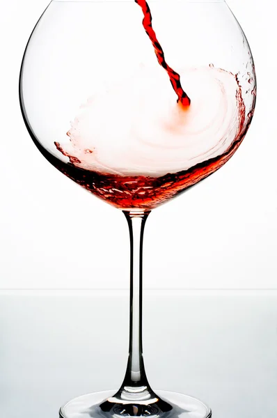 Close up view of wineglass getting filled with red wine — Stock Photo, Image