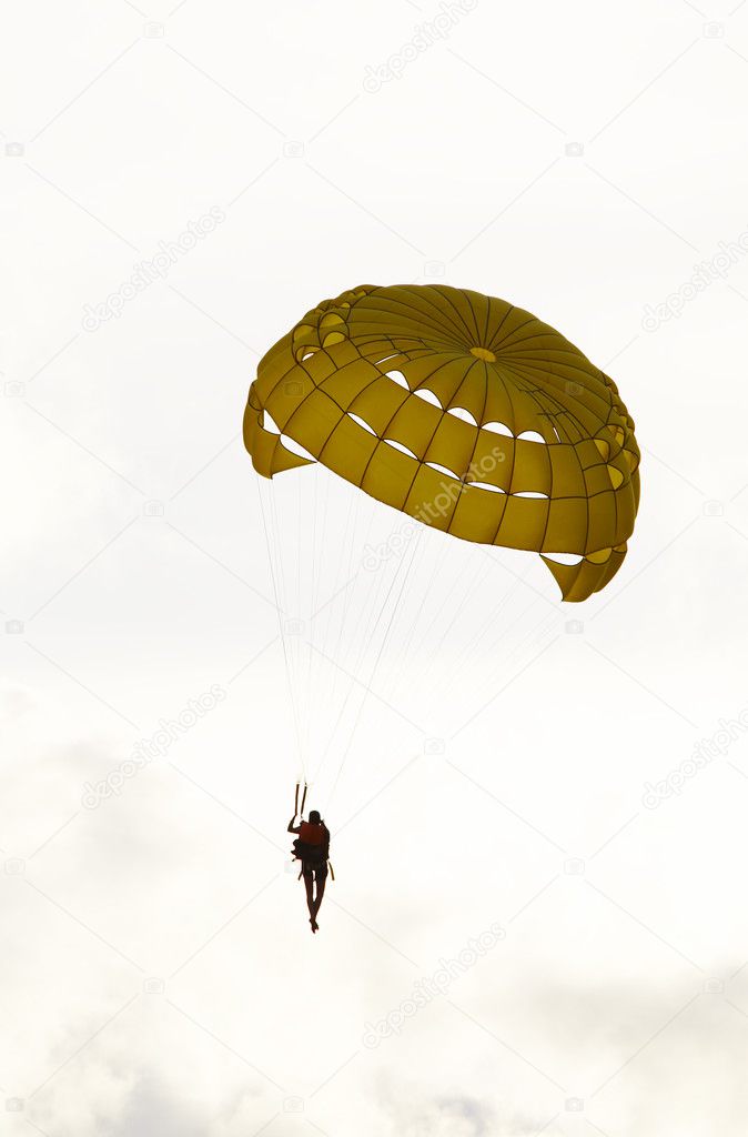 View of nice parachute flying high in the sky