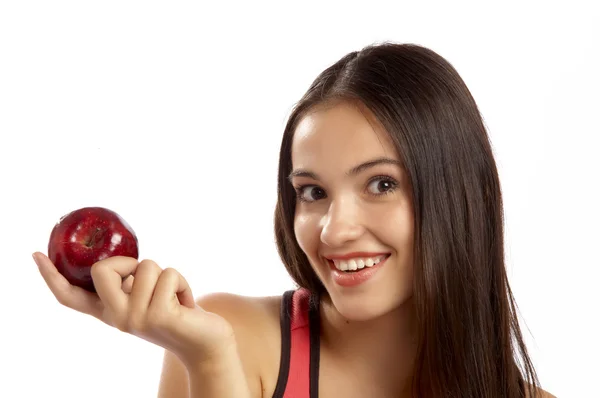 Portrait of young lovely brunette holding big red apple — Stock Photo, Image