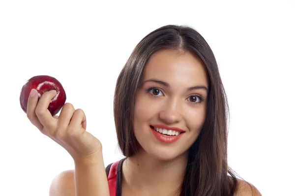 Portrait of young lovely brunette holding big red apple — Stock Photo, Image