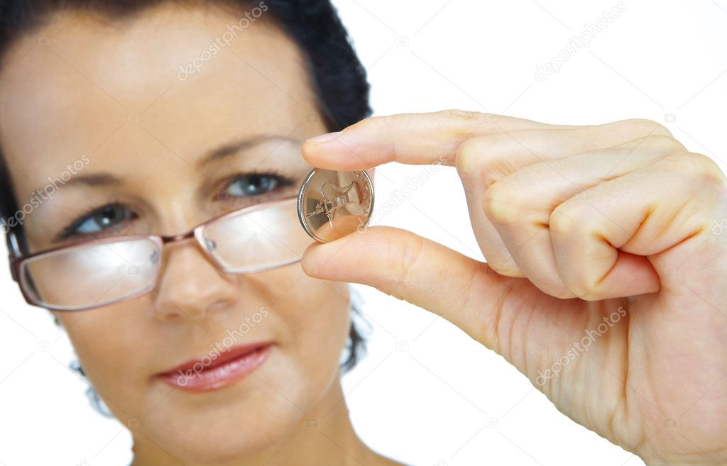 Portrait of woman holding sparkling coin on white back