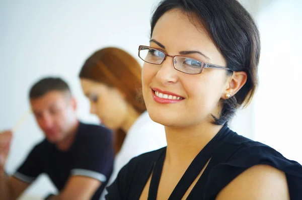 Portrait of young pretty woman in business environment — Stock Photo, Image