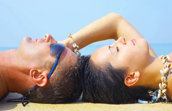 A portrait of attractive couple having fun on the beach Stock Picture