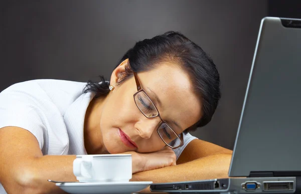 Portrait of a woman dozing on her working place — Stock Photo, Image