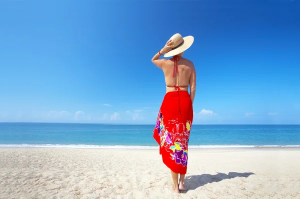 View of female back on a background of the tropical sea — Stock Photo, Image